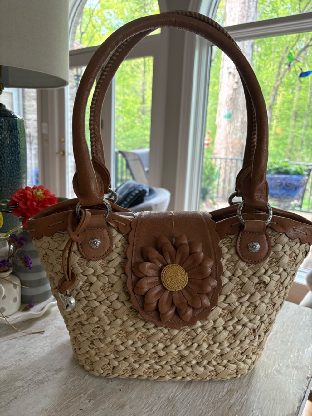 Brighton NWOT woven sunflower shoulder bag with leather trim.
